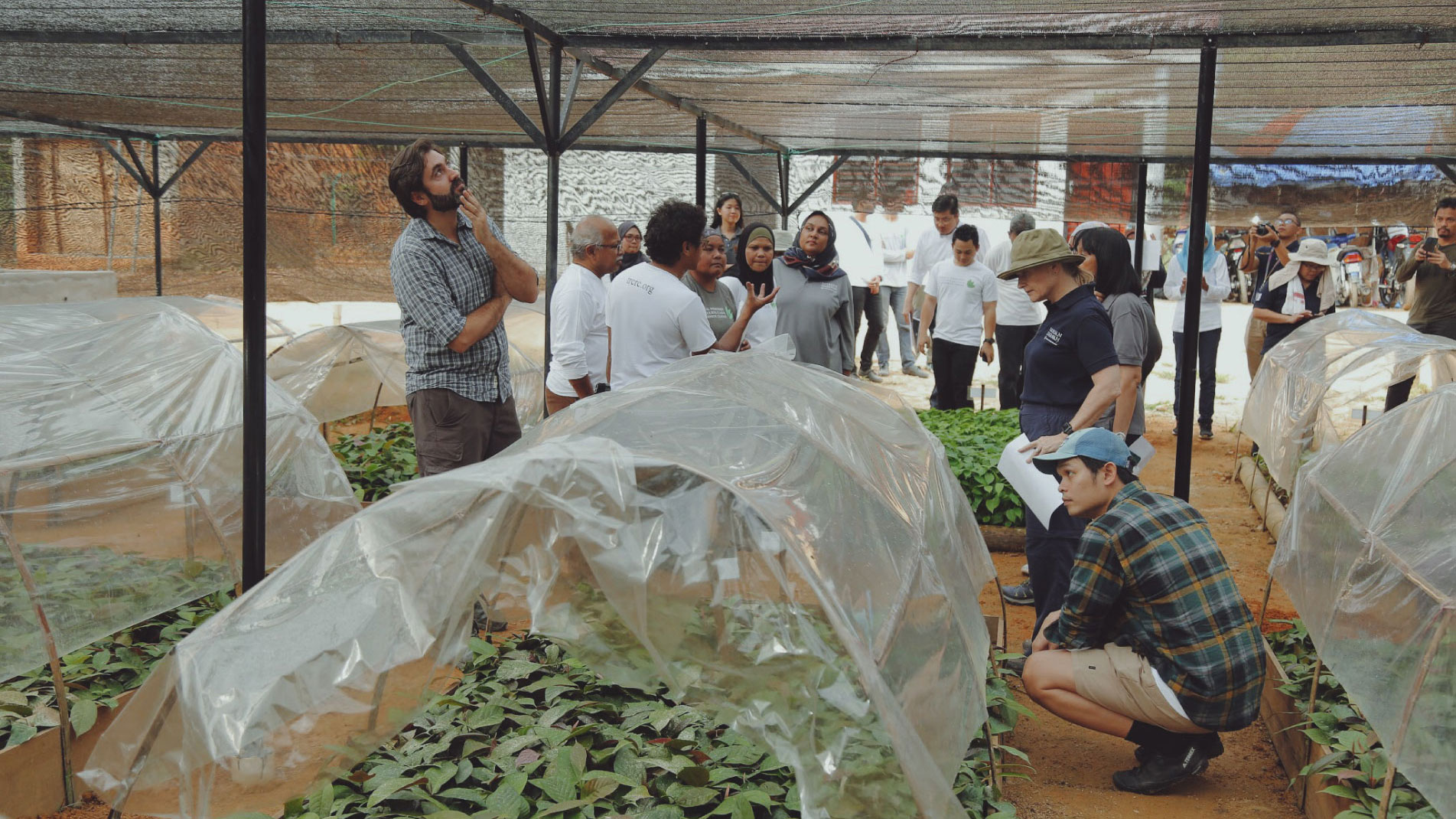 Dzaeman explaining to the Yayasan Hasanah's board of trustees on the mechanics of seed germination in TRLC Banun.